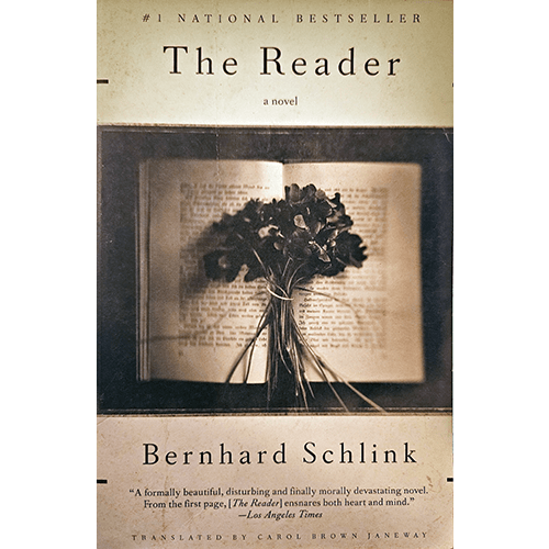 The cover of The Reader by Bernhard Schlink features a sepia-toned image of an open book adorned with a bouquet of dried flowers, evoking themes of memory, love, and loss.