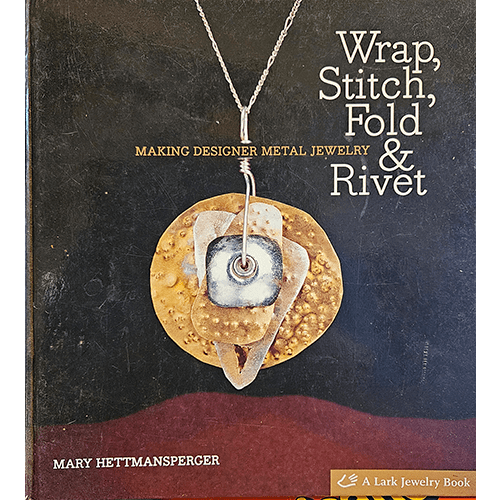 The cover of Wrap, Stitch, Fold & Rivet features a unique metal jewelry piece suspended on a necklace. The book's title is in bold white text, showcasing techniques for creating designer metal jewelry.