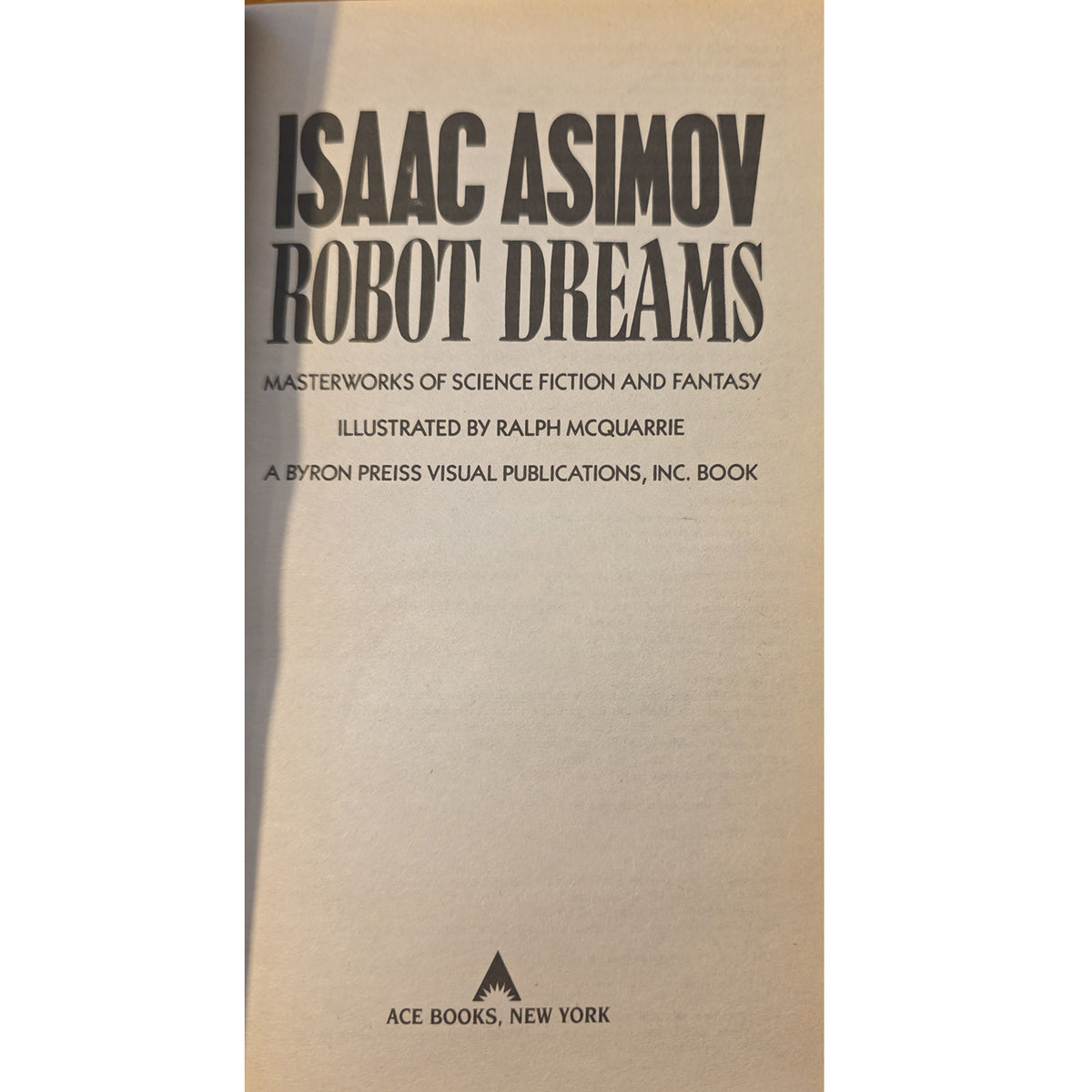 half title of the book Isaac Asimov: Robot Dreams, showing a beige cover with black text and the Ace Books, New York logo at the bottom.