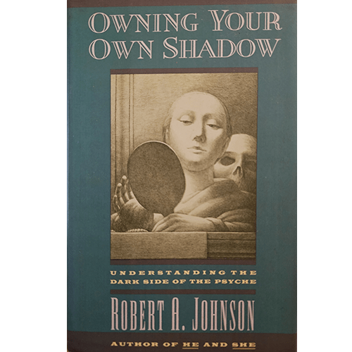 Cover of Owning Your Own Shadow by Robert A. Johnson, featuring an art image of a contemplative figure holding a mirror with a shadowed face behind them, symbolizing inner exploration and self-awareness.