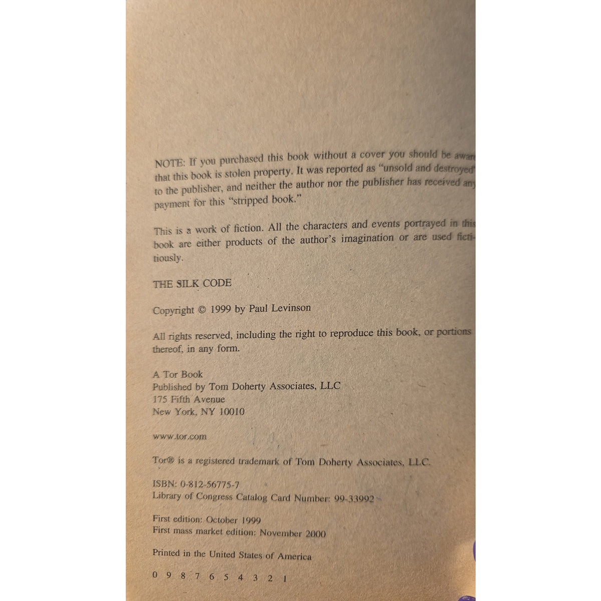 'The Silk Code' by Paul Levinson, showing copyright details, publisher information for Tom Doherty Associates, and printing information on aged, tan paper.