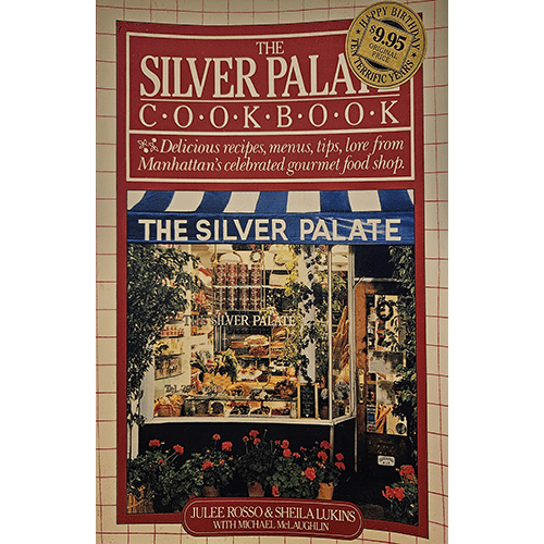 Cover of The Silver Palate Cookbook by Julee Rosso and Sheila Lukins, featuring a beautifully decorated storefront of the famous Manhattan gourmet shop, surrounded by plants and flowers