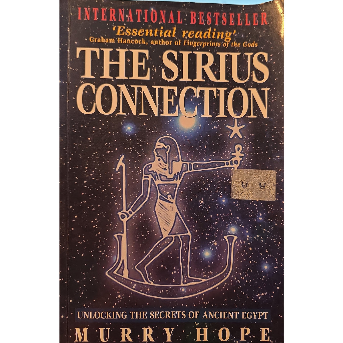 The front cover of the book 'The Sirius Connection' by Murry Hope, featuring a dark starry space background with an Egyptian figure illustration and gold and red text.