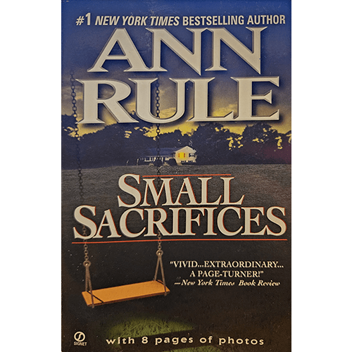 Cover of Small Sacrifices by Ann Rule features a haunting image of a yellow house under a dark sky, with a lone swing in the foreground, symbolizing the chilling and tragic story within.