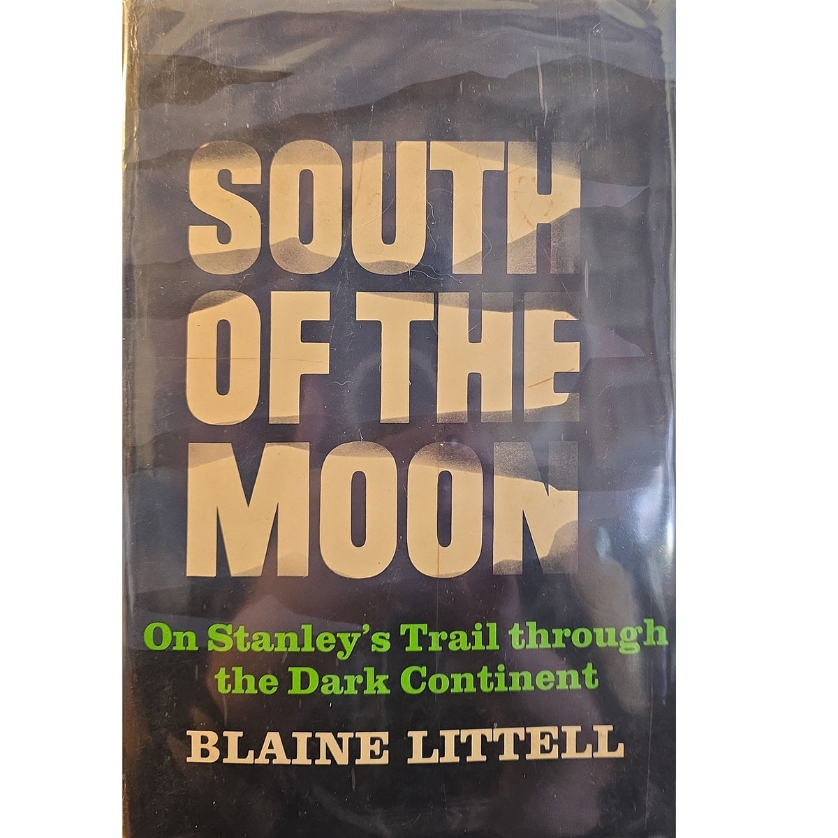 South of the Moon book cover by Blaine Littell, featuring a dark background with large beige title text and green subtitle text.