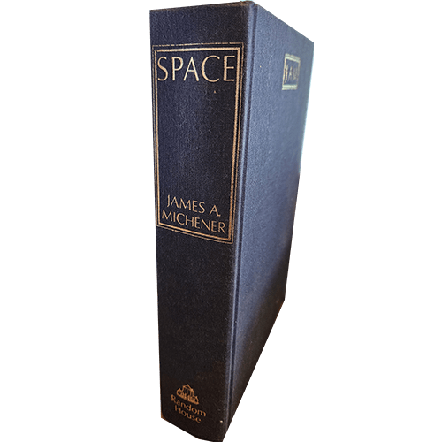 The spine of Space by James A. Michener features a dark blue cloth cover with gold text, including the author’s name and publisher, Random House, at the base. The book is in very good condition.