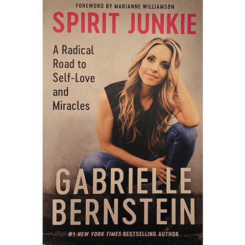 Cover of Spirit Junkie: A Radical Road to Self-Love and Miracles by Gabrielle Bernstein, featuring the author seated and smiling warmly against a neutral background.