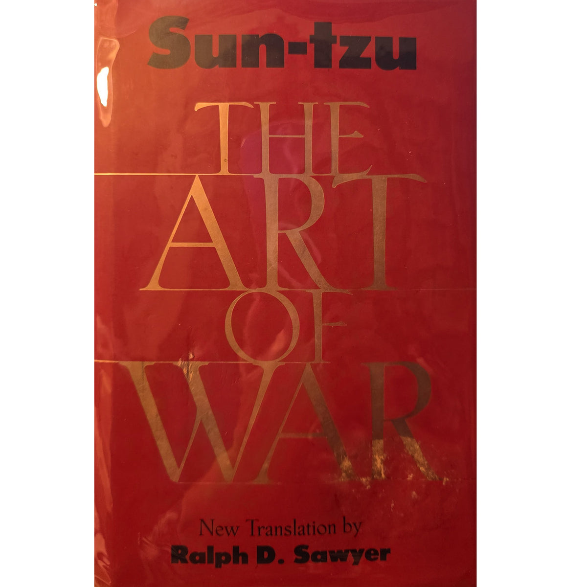 Book cover of 'The Art of War' by Sun-tzu, featuring a red background with gold lettering and black text for the author and translator names.