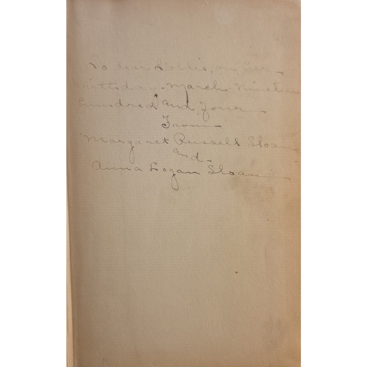 A vintage handwritten letter or inscription on aged beige paper, shown against a white background.