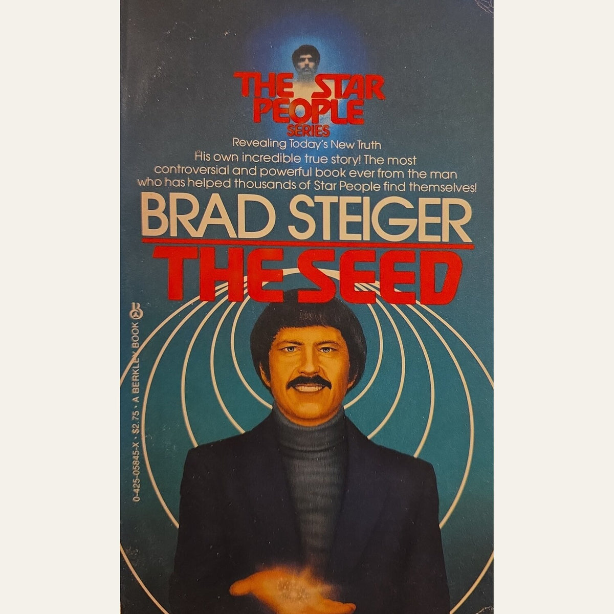 The front cover of the book 'The Seed' by Brad Steiger, part of 'The Star People Series'. The cover features a portrait of the author in a black suit and beret against a teal background with gold concentric circles and bold red and gold text.