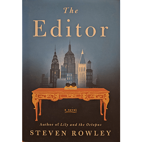 Book cover of "The Editor" by Steven Rowley featuring a skyline of New York City with an elegant desk in the foreground, symbolizing the intersection of storytelling and the publishing world.