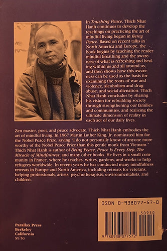 Back cover of the book 'In Touching Peace' by Thich Nhat Hanh, published by Parallax Press. The cover features a dark brown background with a portrait of Thich Nhat Hanh, extensive text, and a barcode with ISBN 0-93407570-7.