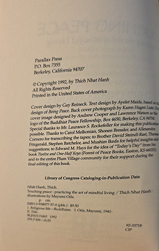 A scanned book cover or publication page from Parallax Press, printed on aged off-white paper. Visible text includes the title 'Touching peace: practicing the art of mind living / Thich Nhat Hanh', copyright information, publisher details, and cataloging data.