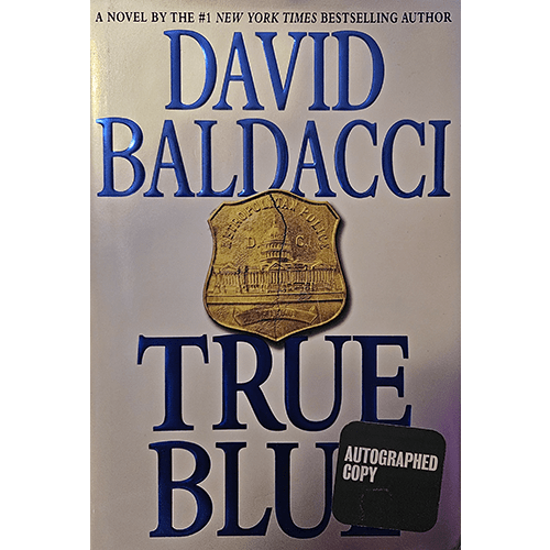 The cover of True Blue by David Baldacci features bold blue and black text on a silver background with a police badge at the center. "Autographed Copy" is marked on a black sticker in the lower corner.