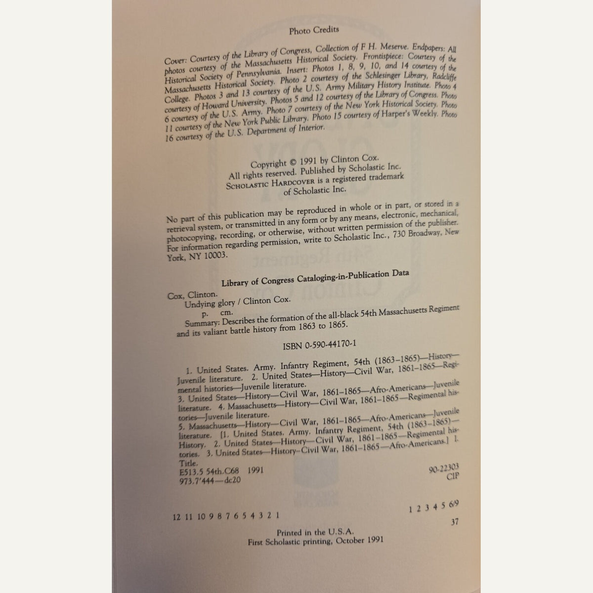 A scanned book cover or publication page with printed text, including a photo credits section, copyright notice for Clifton Cost, Library of Congress Cataloging-in-Publication Data, ISBN 0-546-44101-0, and publication details.