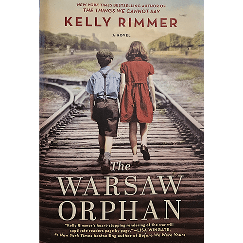 The cover of The Warsaw Orphan features a young boy and girl, dressed in 1940s attire, walking hand in hand on train tracks. The image conveys a poignant sense of innocence amidst the backdrop of war.