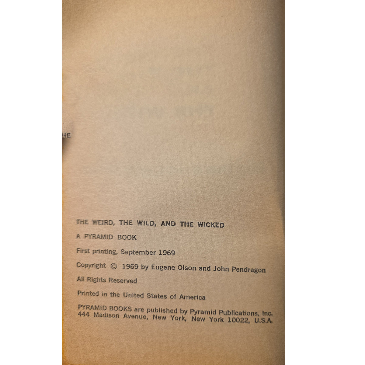 copyrightof a vintage book titled 'The Weird, the Wild, and the Wicked' showing publication details on aged beige paper.