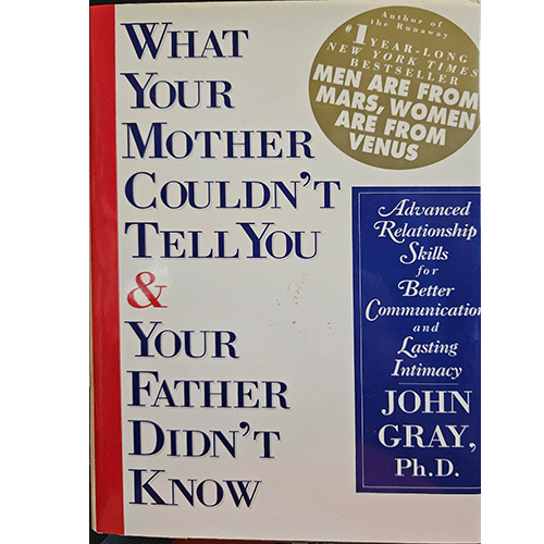 Cover of John Gray's What Your Mother Couldn't Tell You & Your Father Didn't Know, featuring bold red and blue text on a white background. A gold emblem highlights his bestseller Men Are from Mars, Women Are from Venus.